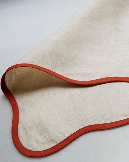 Beige linen placemat with rust wavy edge – view 2